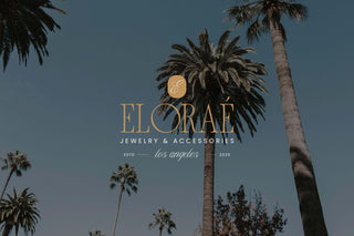 Elorae jewelry and accessories logo with palm trees in the background.